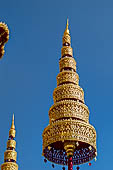 Bangkok Grand Palace, the Wat Phra Keow (temple of the Emerald Buddha), detail of the gilded umbrella of one of the four monuments dedicated to Chakri kings. 